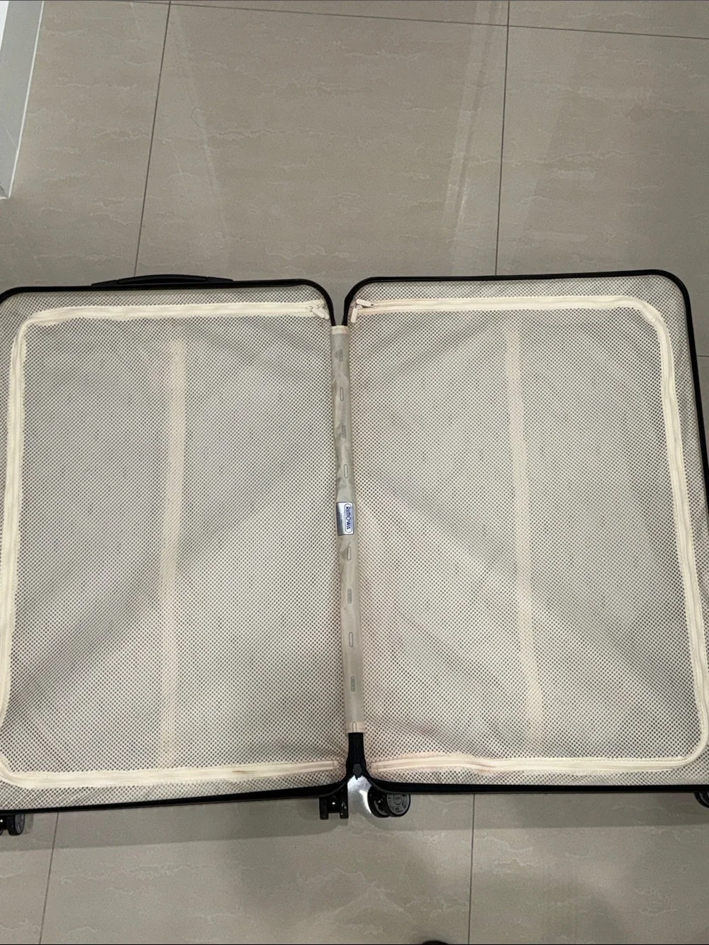 RIMOWA Salsa Air Multiwheel acrylic suitcase in Ice Blue.